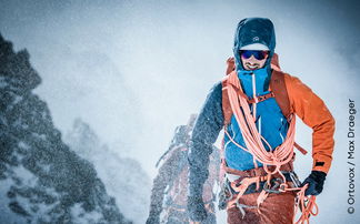 Mountaineers in outdoor clothing in a snowstorm in the mountains.