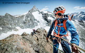 Climber abseiling in the Alps.