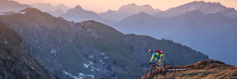Mountain biker rides through a spectacular mountain landscape