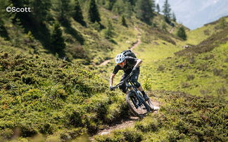 Mountain biker on a single trail in the mountains