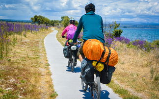 Cyclist with trekking bike and luggage on a bike tour