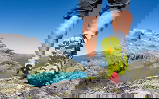 Trail running sole against mountain backdrop